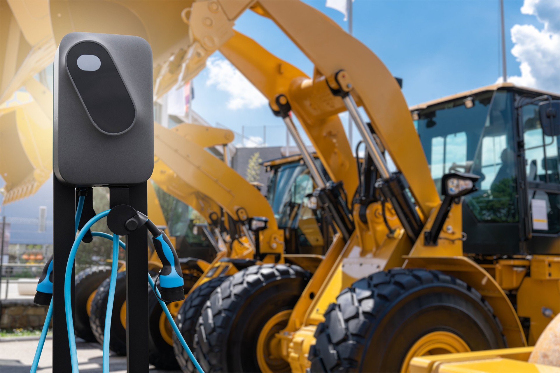 Electric construction machines with charging station.