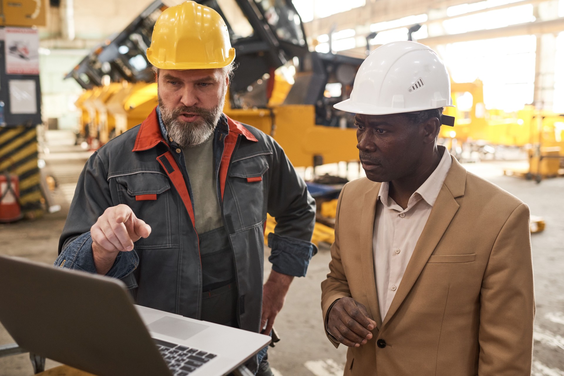 Foreman presenting new equipment to engineer